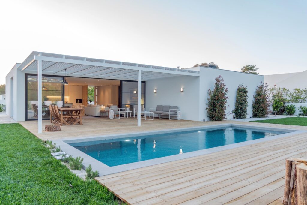 an inground pool and custom decking from Lakeside Luxury Pools