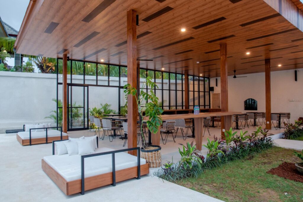 an outdoor sitting area for hosting near a pool that's offscreen